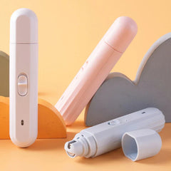 Pet paw being gently filed with the paw grinding tool