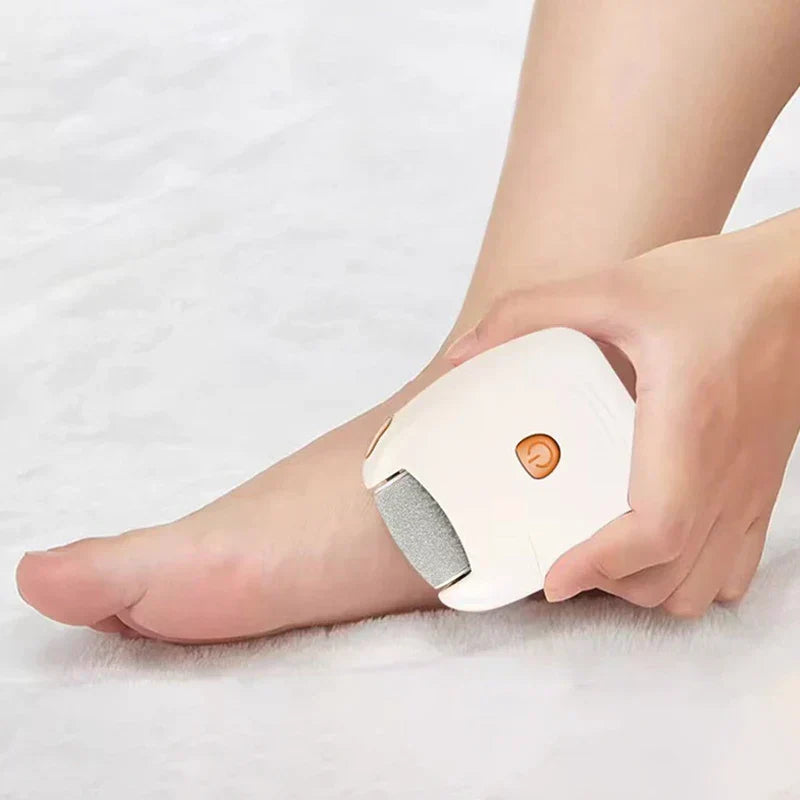 Cordless electric foot file in use on foot