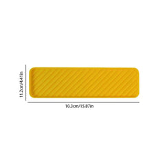 Leuchtend gelbe rechteckige Getränkematte mit diagonalen geprägten Rillen, mit Größenangaben von 10,3 cm x 11,2 cm auf weißem Hintergrund.