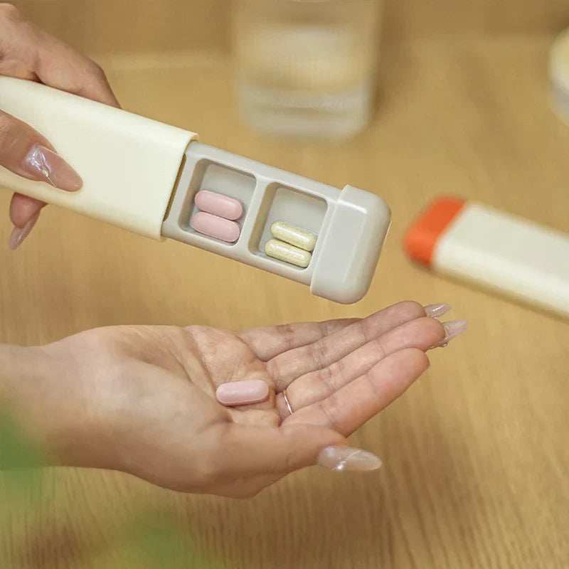 Hand holding open grey weekly pill organizer with pills, pouring a pill into an outstretched palm