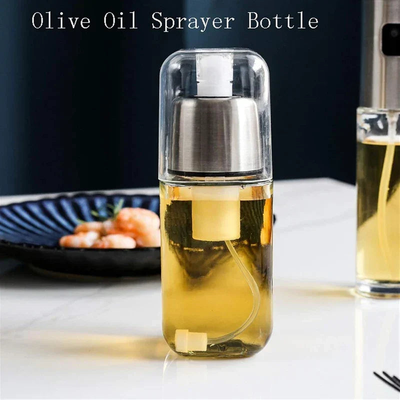Oil sprayer dispenser filled with yellow liquid, sitting on white counter near a plate of shrimp