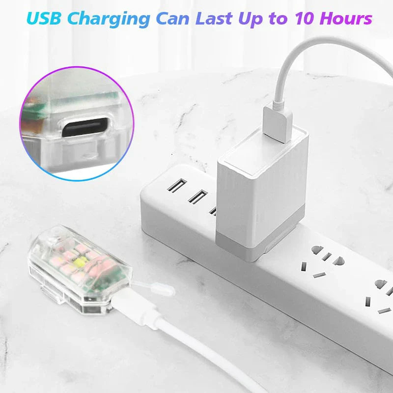 Transparent USB rechargeable led warning light charging via USB cable connected to a power strip, with close-up of its USB-C port.