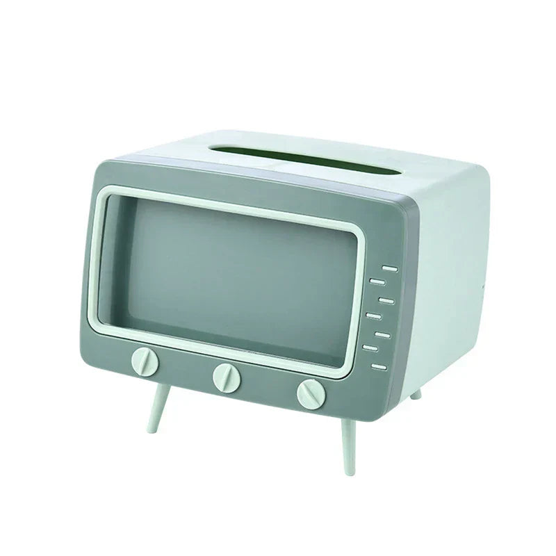 Retro television-styled light green and gray tissue box holder with control knobs, side details, short legs, and top tissue slot