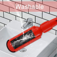 Red lint brush roller being rinsed with running water over a white sink, with 'Washable' text overlaid.