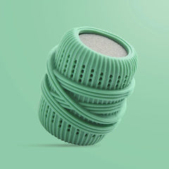 Mint green cleaning ball with ridged texture, holes, and wrapped bands, against a solid mint green background