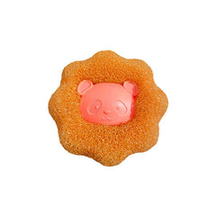 Bola de lavandería naranja con forma de flor y cara de panda, con cuerpo texturizado poroso.