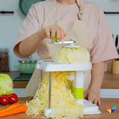 Rotary cheese grater grating a block of cheese