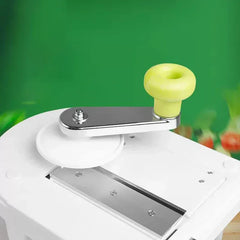 Close-up of rotary kitchen tool crank with yellow knob on white base, does homegood have rotary cheese grater