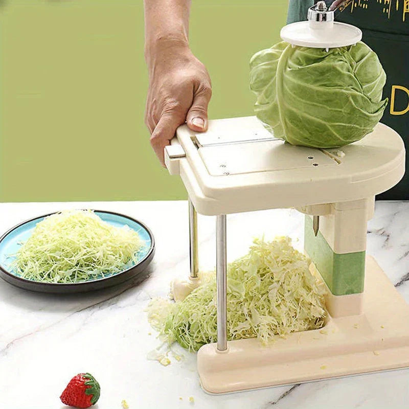 Hand holding rotary vegetable slicer shredding cabbage into strips, does homegood have rotary cheese grater