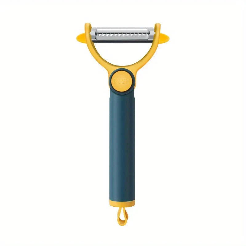 Pelador de verduras bicolor amarillo y verde azulado con hoja dentada horizontal, botón pulsador en el mango y orificio para colgar en la base