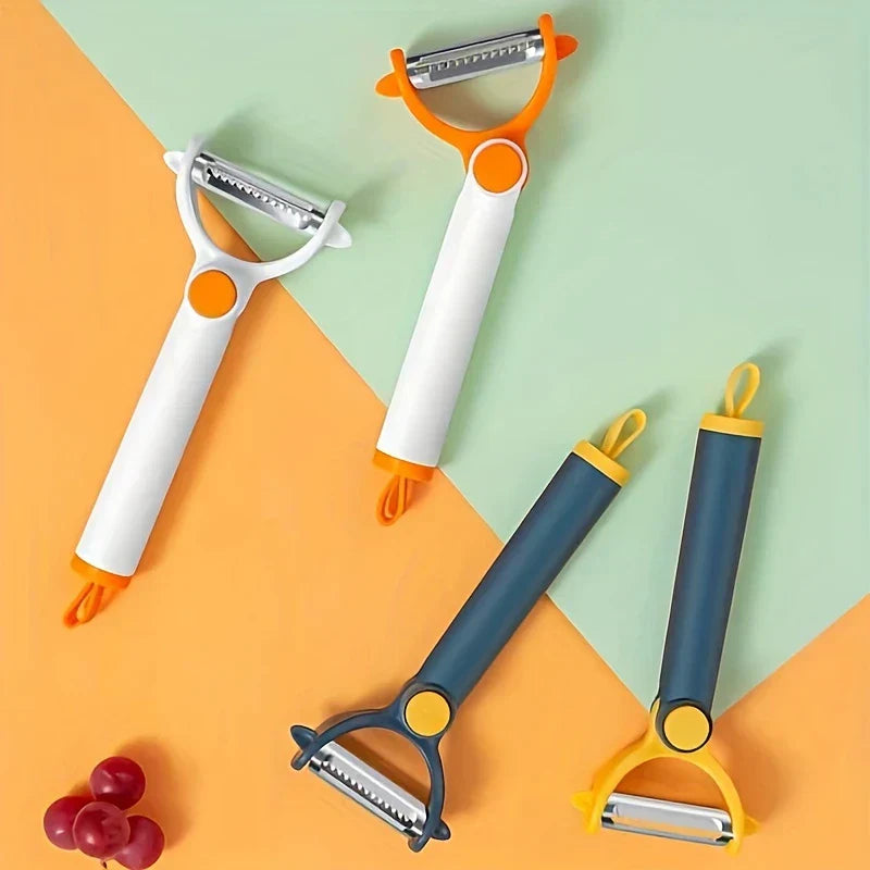 Vegetable Peeler - Four vegetable peelers in white-orange and blue-yellow styles laid on split orange and mint green background, with a small cluster of red grapes at bottom left