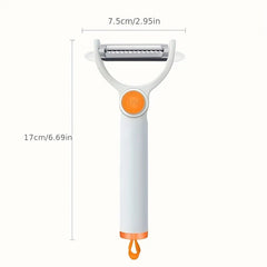 White and orange vegetable peeler with dimensional measurements labeled in centimeters and inches on a plain light background