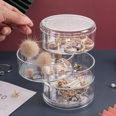 Close-up of the rotating jewelry organizer box showing multiple compartments