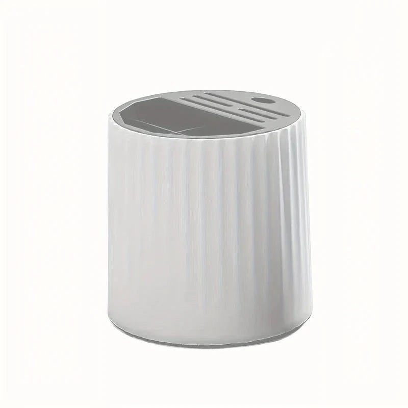 White ribbed rotating kitchen utensil holder with gray top featuring slotted and open storage sections