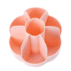 Light pink flower-shaped makeup brush holder with multiple divided compartments on a white background
