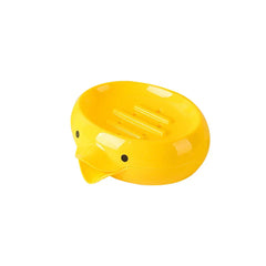 Bright yellow duck-shaped soap dish holder with inner drainage ridges, on a plain white background
