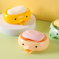 Round duck soap dish holder placed near a bathtub