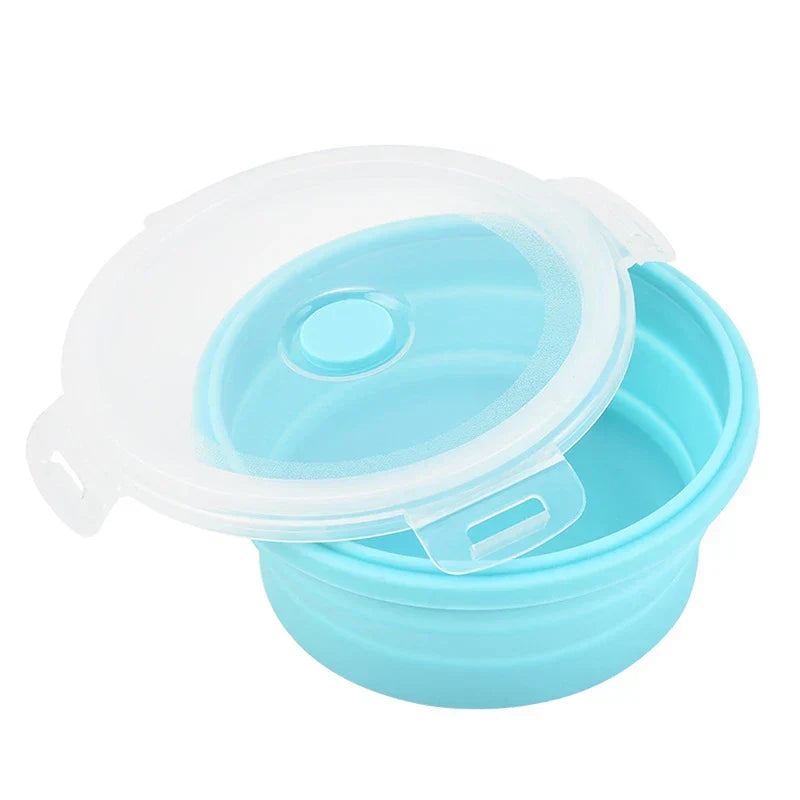 Single open round light blue food storage container set piece showing clear snap-on lid resting on the container rim