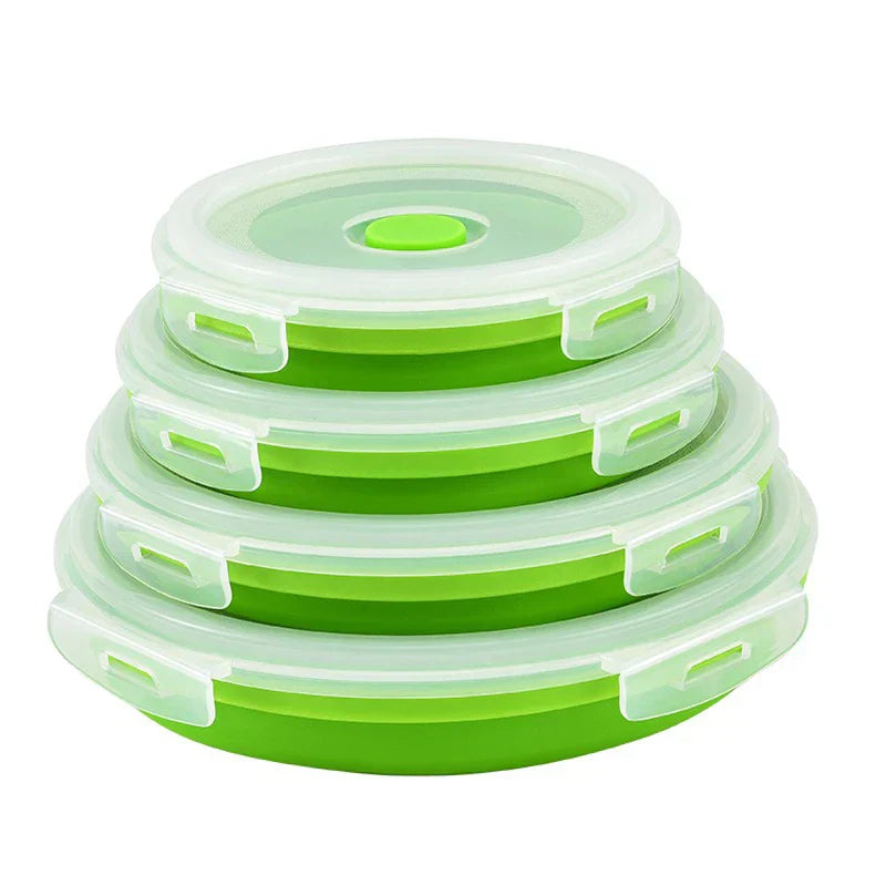 Four green collapsible food storage container set with lids, nested and stacked in ascending size order on a white background