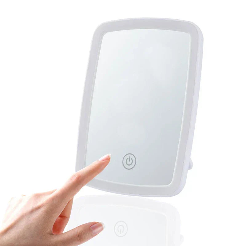 Close-up of the light mirror assembly showing the integrated LED light