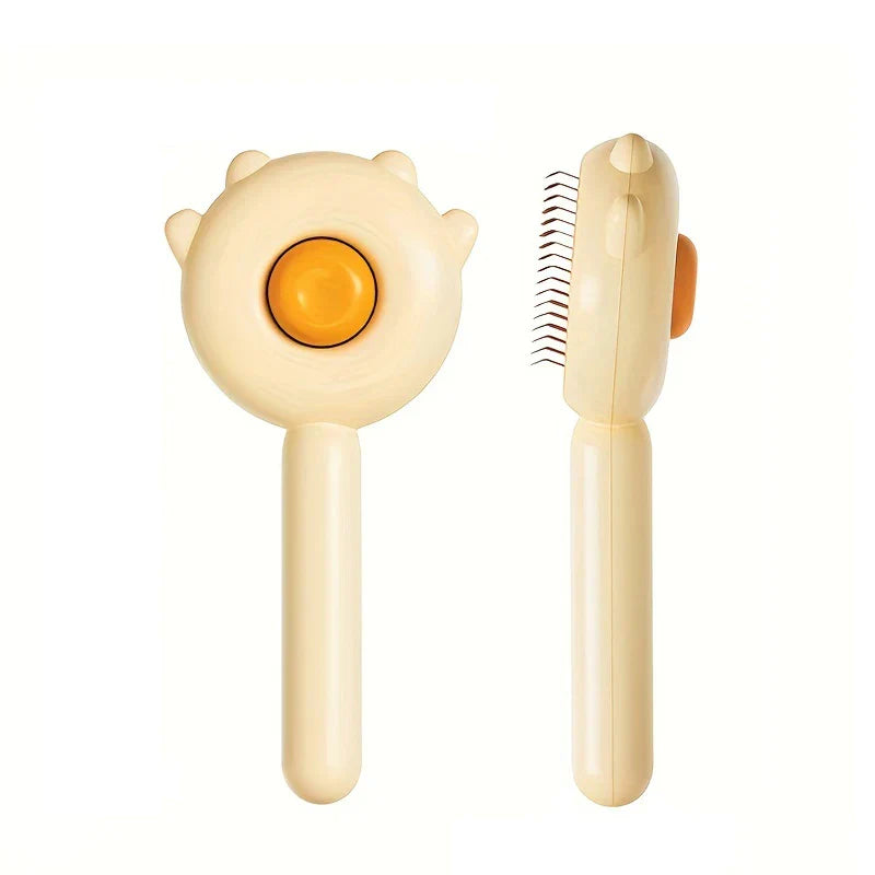 Two views of a cream cat-shaped pet slicker brush, showing the button front and needle side profile on a white background