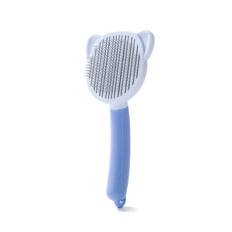 Light blue cat ear shaped pet self cleaning slicker brush with textured handle, on white background