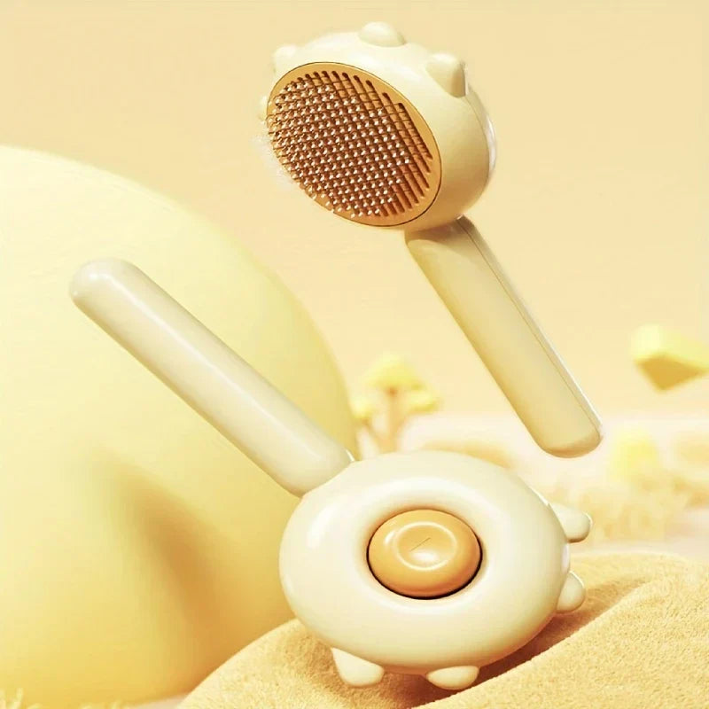 Close-up of the self-cleaning mechanism on a pet slicker brush