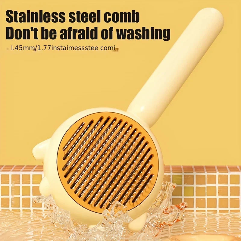 Cream pet slicker brush with slotted stainless steel comb face rests in shallow tiled water