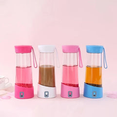 Four portable blender cups in pink, white, light pink, blue with drinks, a coffee mug on a pink background