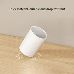 mouthwash cup holder with toothbrush slot in a small bathroom setting