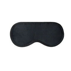 Blackout sleep mask on a bed