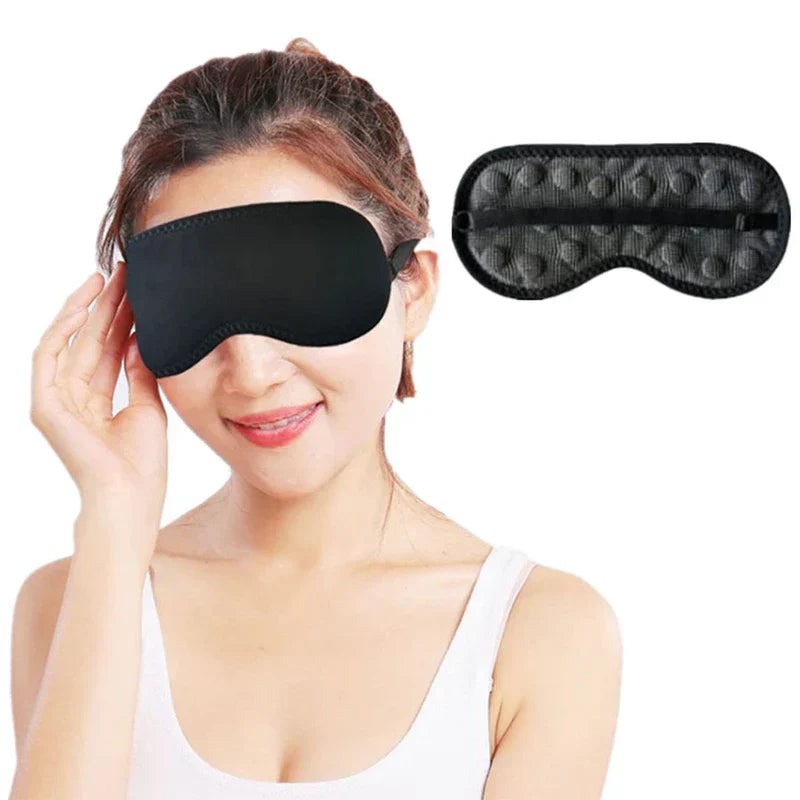 Blackout sleep mask worn by a person sleeping