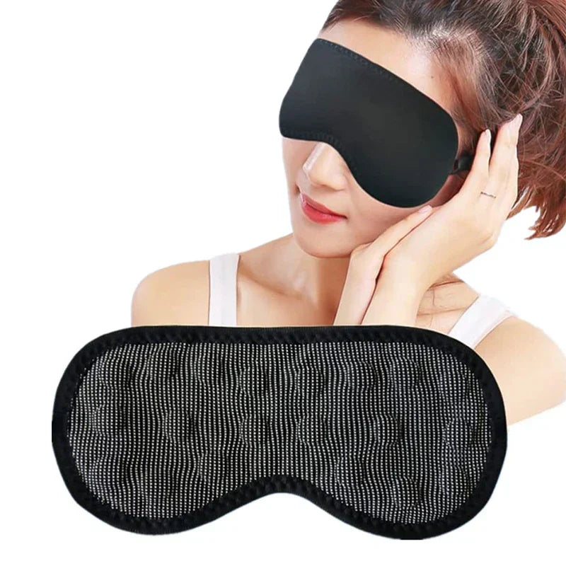 Blackout sleep mask held in hand