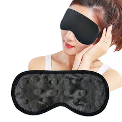 Blackout sleep mask held in hand