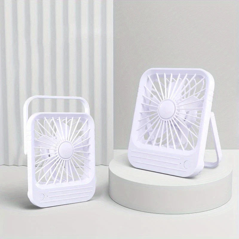 Desktop Quiet Fan - Two white desktop quiet fans, one on a circular display stand, against a curtain and light gray wall background
