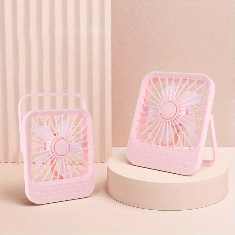 Desktop Quiet Fan - Two pink square desktop quiet fans, one on a beige cylindrical stand and one on a flat surface, set against a light pink background