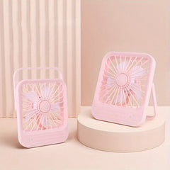 Desktop Quiet Fan - Two pink square desktop quiet fans, one on a beige cylindrical stand and one on a flat surface, set against a light pink background
