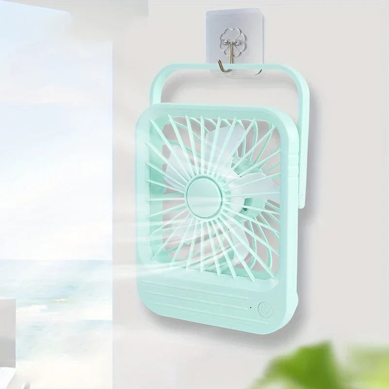 Small USB desk fan in a home office