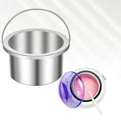 Stainless steel wax pot insert and pink melted wax in wax warmer with spatula