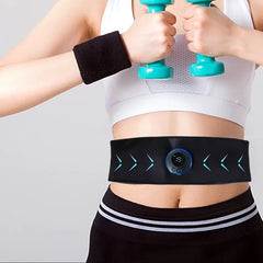 A person wearing a white sports bra and holding dumbbells has a flex belt abdominal muscle toner fastened around their waist.