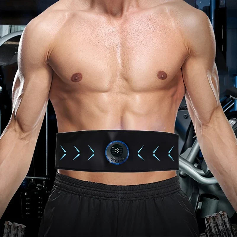 Shirtless man in gym wearing a flex belt abdominal muscle toner around his waist