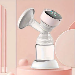 Pink and white electric breast pump with digital control panel, placed on a pink rounded surface with soft pink decor