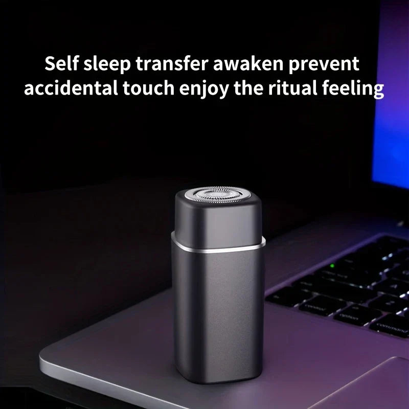 Gray electric shaver rests on a laptop with product text about preventing accidental touch above it