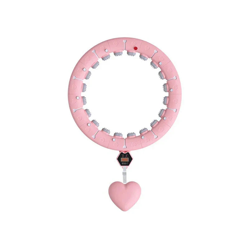 Full top view of a pink weighted fitness hula hoop with heart-shaped hanging weight and digital counter module