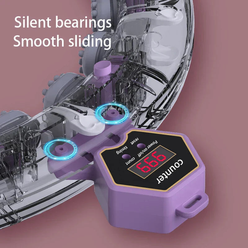 Close-up of a weighted fitness hula hoop's counter module and internal sliding bearings, with text reading Silent bearings Smooth sliding