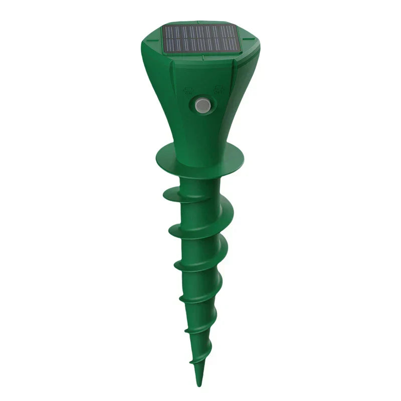 Solar ultrasonic snake rodent repeller spike installed in a garden