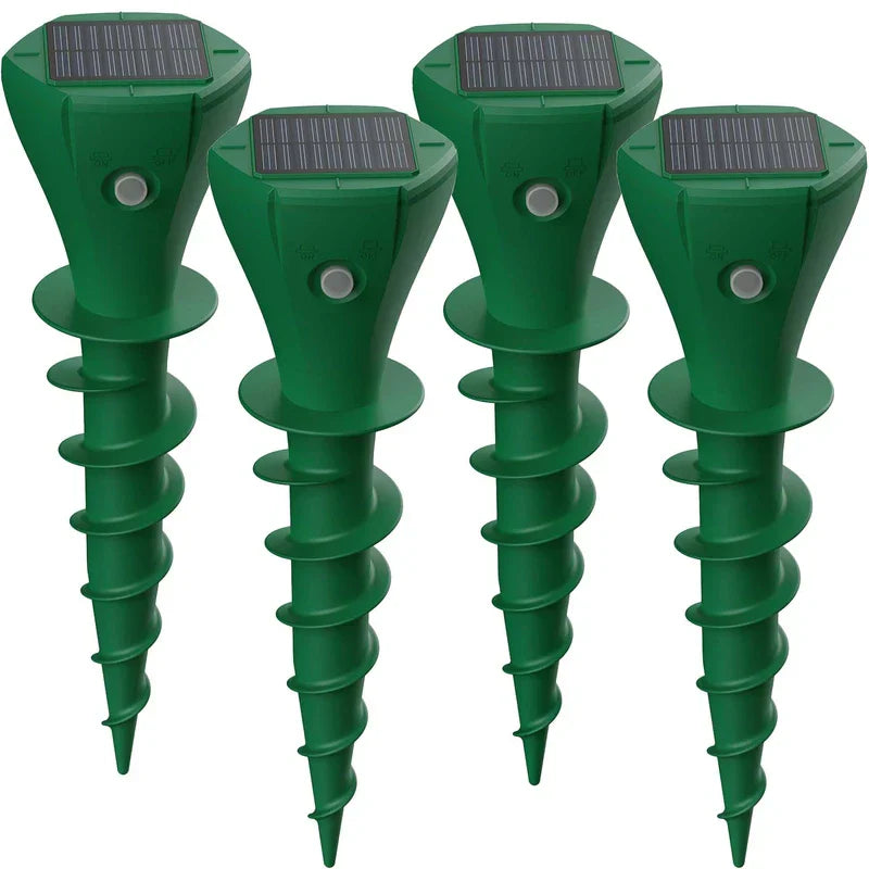 4-pack green solar powered mole repellent spike stakes, white background
