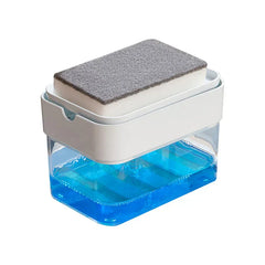 Soap dispensing cleaning brush with press mechanism on a kitchen counter