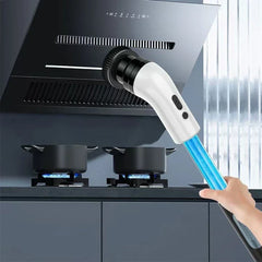 Electric cleaning scrub brush cleaning a black range hood over two lit gas stovetops with pots.