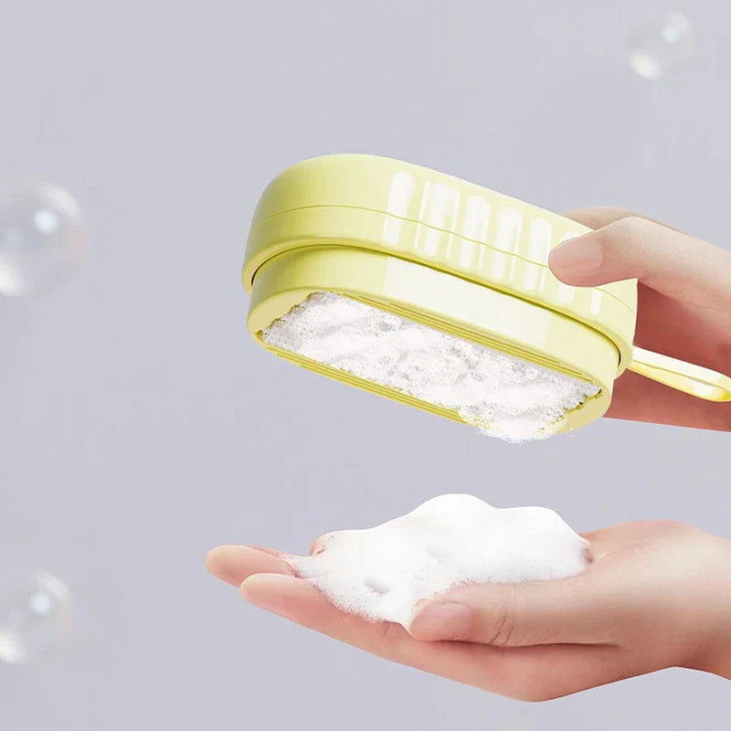 Laundry Scrub Brush - Hand holding a yellow oval soap dispenser above an open palm catching dispensed white foam